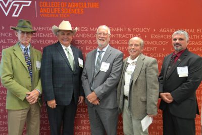 The inductees pose, from left to right: Edmund "Tad" Coffin, Mark Duffell, Richard Wilkes,  Leo Tammi, and Jeremy Pittman.