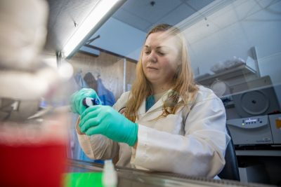 A person working in a laboratory.